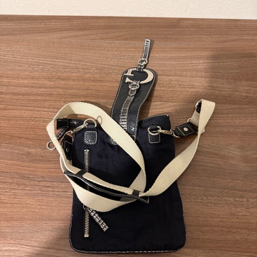 Guess women's leather crossbody bag used, waterproof, black and white