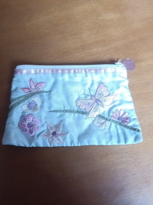 Fabric wallet used with embroidery and zipper in gray and pink