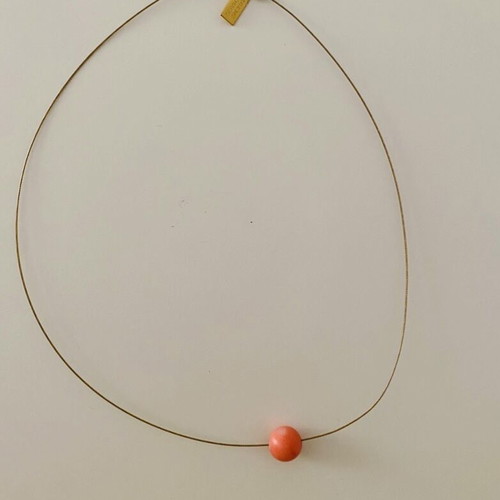 Necklace with orange bead used