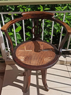 Swivel office armchair used, old with cane seat