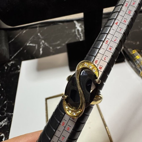 Ring with black stone and rhinestones