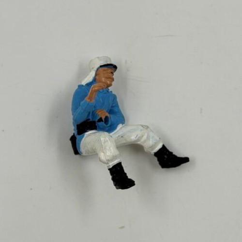 Vintage plastic soldier figure used, seated pose
