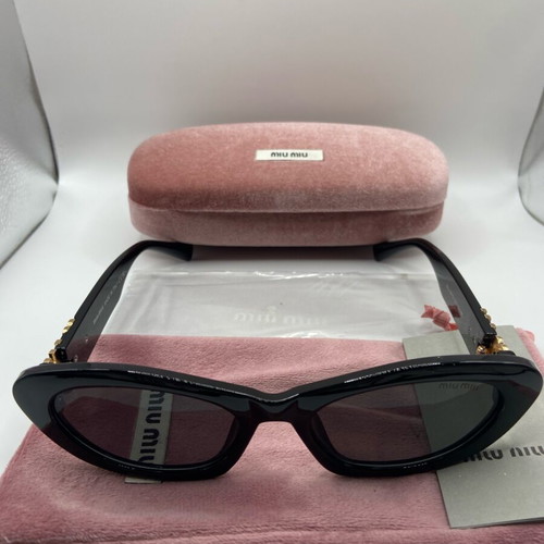 Miu Miu sunglasses new, black and gold for women