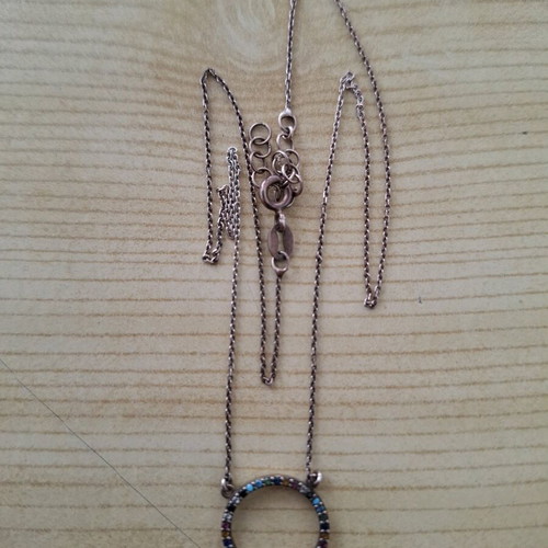 Necklace with circle pendant like new, multicolored stones