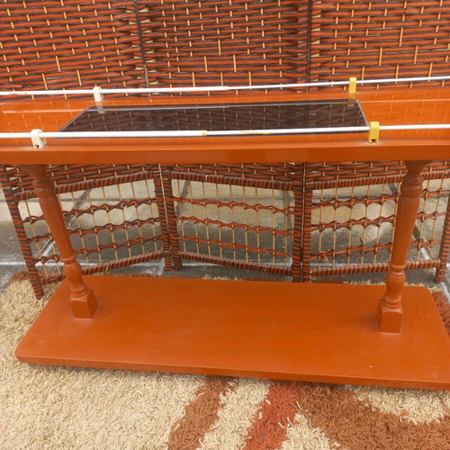 Small wheeled bar used with glass top and storage shelf