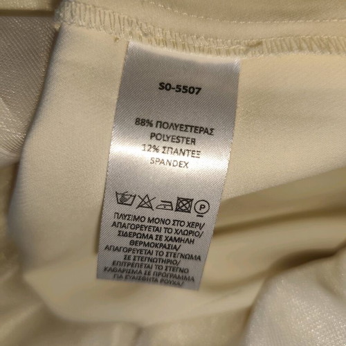 Access jumpsuit extra small white used with minor strap defect