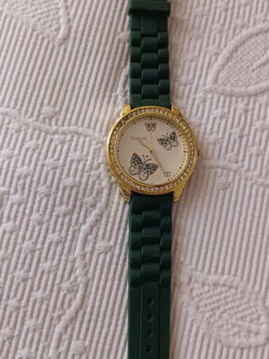 Women's watch like new with green rubber strap and butterfly dial