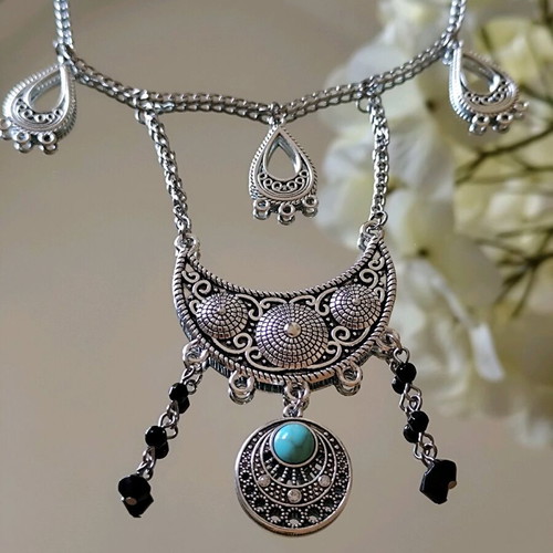 Steel boho necklace like new with turquoise stone and black beads