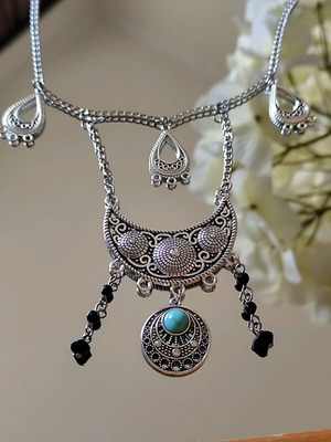 Steel boho necklace like new with turquoise stone and black beads