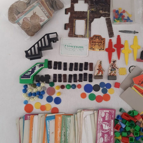 Lot of used game pieces, cards, and play money
