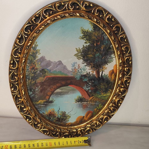 Oval vintage painting on canvas with golden frame used