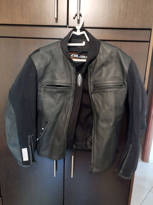 Colori women's motorcycle jacket like new, size small with shoulder protection
