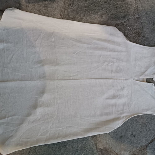 Women's sleeveless top like new, beige, asymmetrical hem