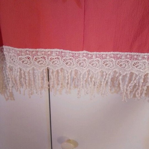 Blouse new with bow back and fringes bottom size L
