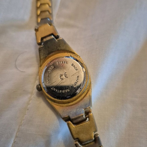 SK women's watch used, gold color