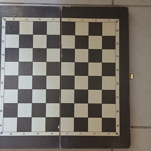 Chessboard with pieces and backgammon
