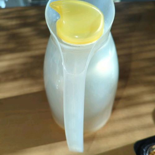 Household thermos like new, milky plastic with orange, glass interior
