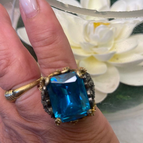 Silver ring plated with 9K gold, like new, blue topaz center