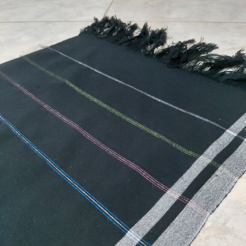 Traditional cotton fabric on loom, new, black with gray stripes and fringes
