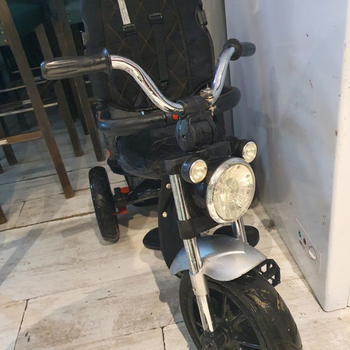 Tricycle used with some fabric wear and missing parts