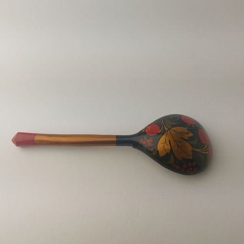 Old painted wooden spoon used