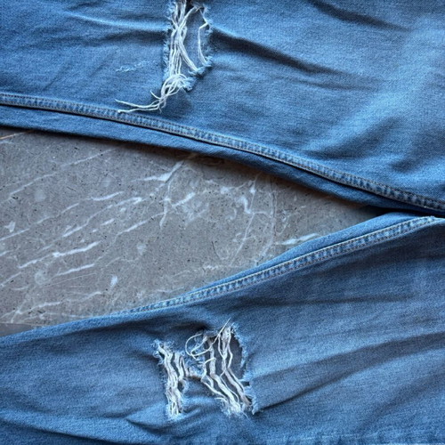 Women's blue jeans with rips and unique zipper like new
