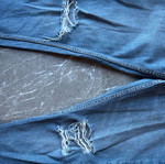 Women's blue jeans with rips and unique zipper like new