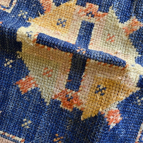 Embroidered pillow used with minor wear