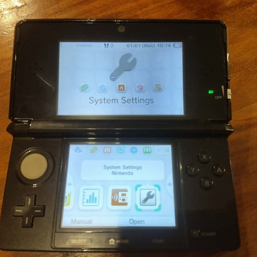 Nintendo 3DS console with charger, memory card and stylus