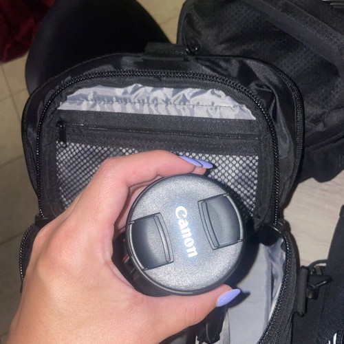Canon EOS 1200D camera kit with lenses, memory card, battery, charger, and carrying bag
