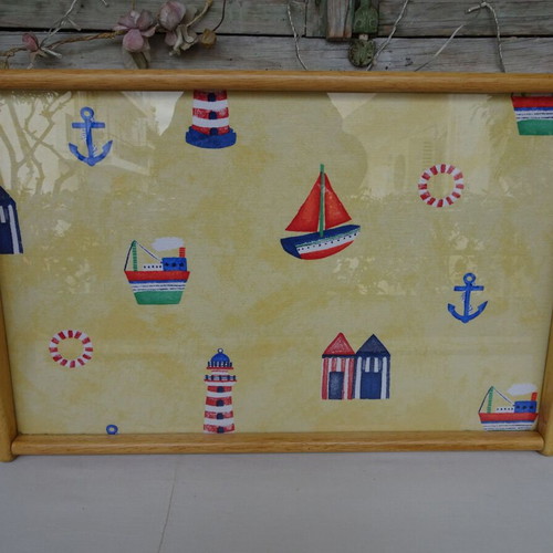 Vintage wooden breakfast tray with nautical theme used