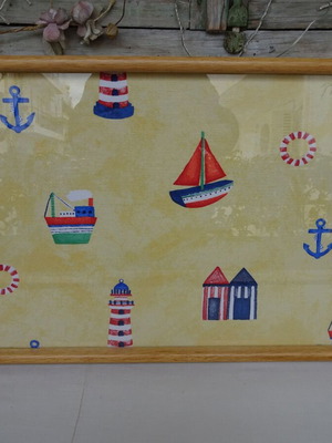 Vintage wooden breakfast tray with nautical theme used