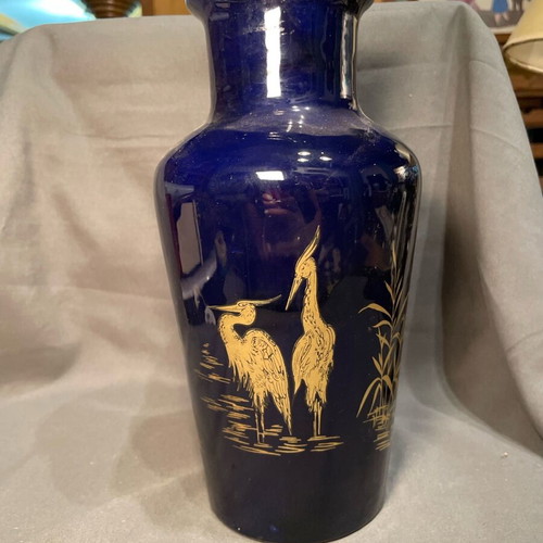 Old porcelain vase dark blue with gold designs used