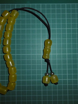 Handmade komboloi with yellow acrylic beads