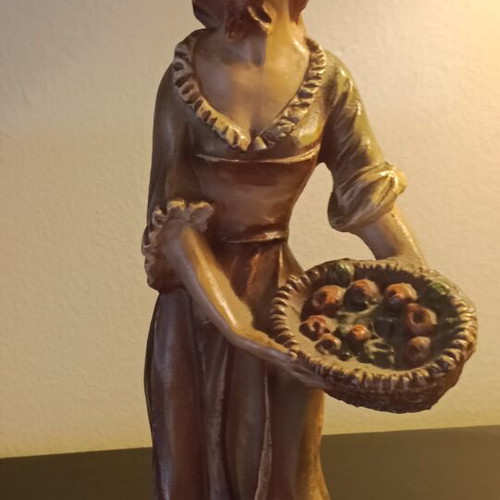 Vintage decorative figurine used, young peasant girl with fruit basket
