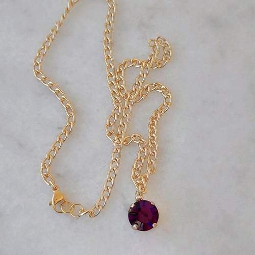 Necklace with purple crystal new with gold chain