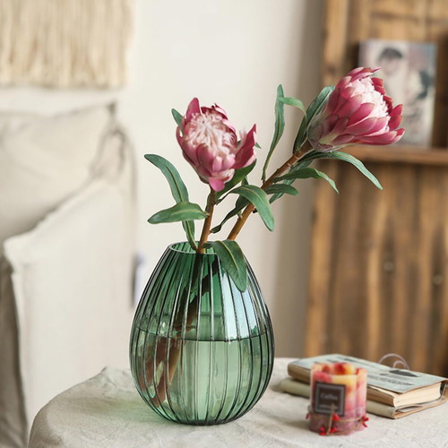 Green glass vase with vertical ribs, 22 x 17 cm