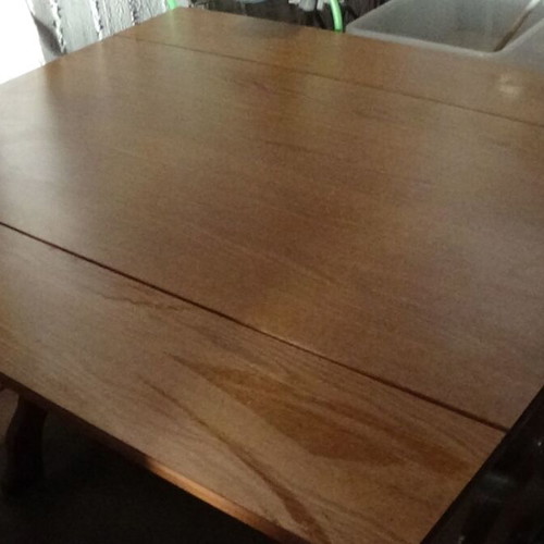 Wooden dining table used with extension