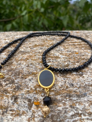 Handmade necklace with black crystal stones and steel motif