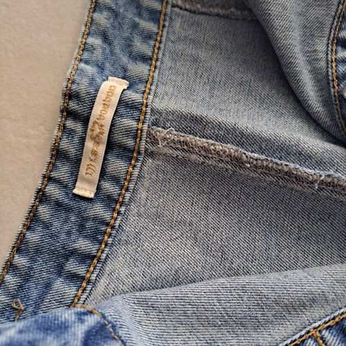 Distressed denim mini skirt with buttons, like new, light wash