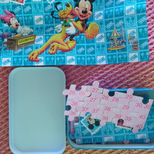 Mickey Mouse puzzle 60 pieces in metal box like new