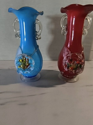 Decorative vases made of blown glass with bright blue and red colors, like new