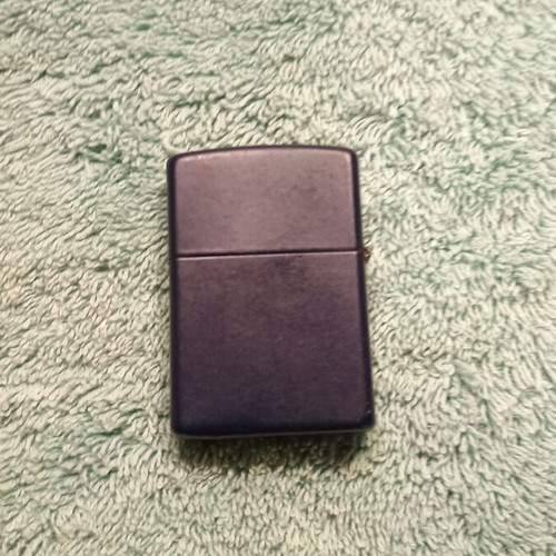 Zippo lighter used blue with purple logo