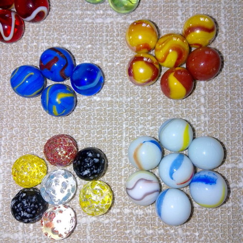 Set of 68 glass marbles used with collectible designs and 2 large shooters
