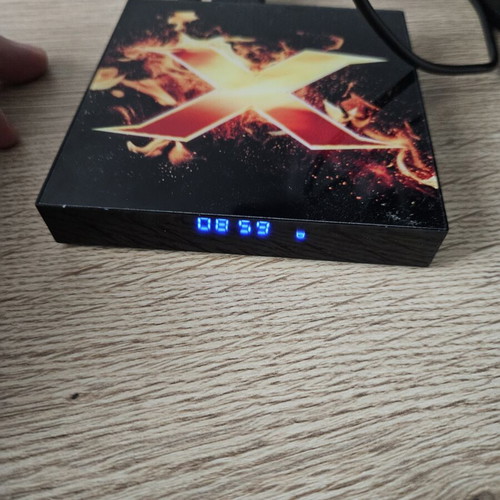 Vontar X1 Smart TV Box used with remote and power adapter
