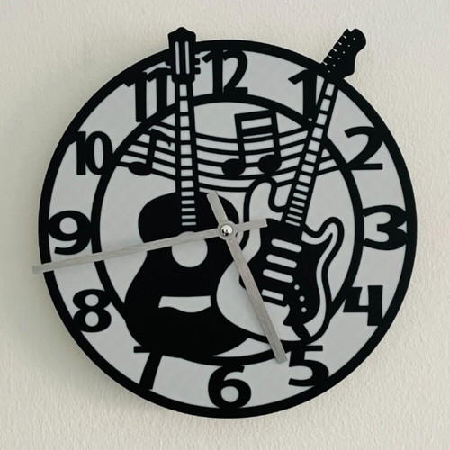 Wall clock with guitar theme like new, analog