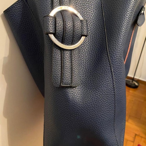 Blue shoulder bag used with brown details