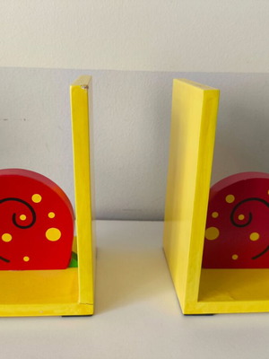 Wooden snail bookends for children's library