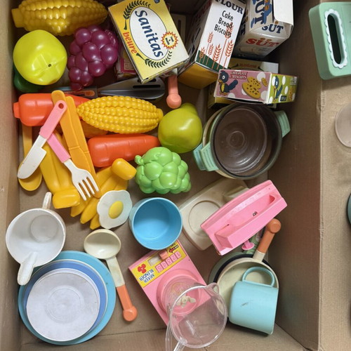 Kitchen playset like new with utensils, food packages, and vegetables