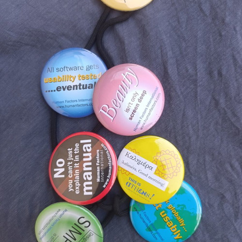 Large colorful pins set of 7 on safety cord, like new